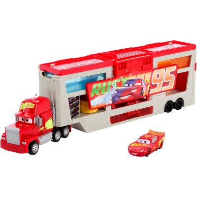 Mattel HPD82 CARS Mack Officina Cambia Colore con truck e Saetta McQueen trasformabili cabina di guida e accessori